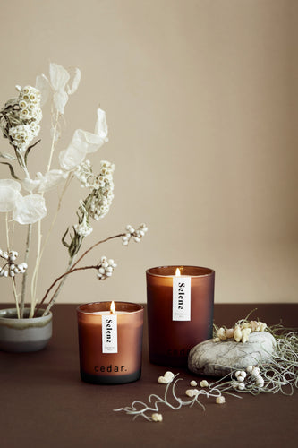 Selene candle from Cedar. Frosted amber glass jar. Small and large size pictured without black wooden lid. 