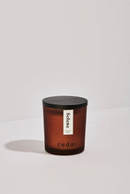 Load image into Gallery viewer, Small Selene essential oil candle in an frosted amber jar with a black wooden lid. 